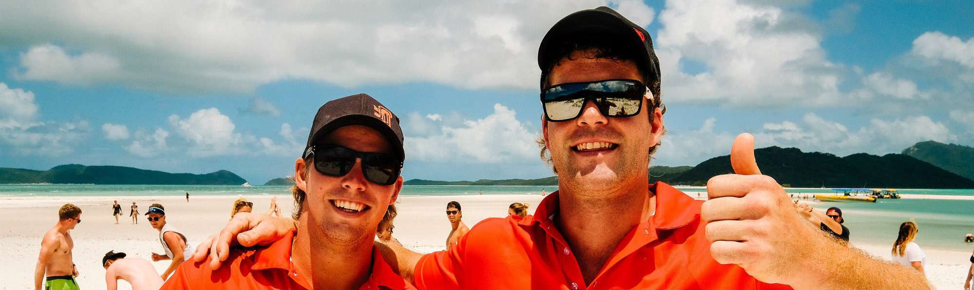 Our Team banner 3 a man wearing sunglasses taking a selfie in front of a body of water