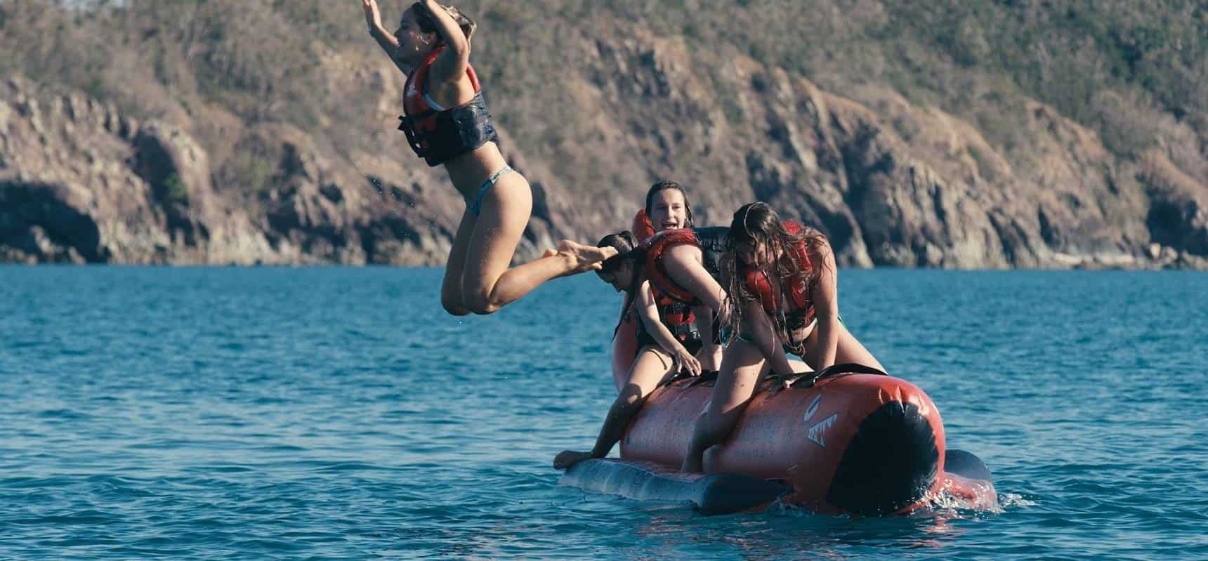 Tongarra banana boat rides a person riding a surf board on a body of water
