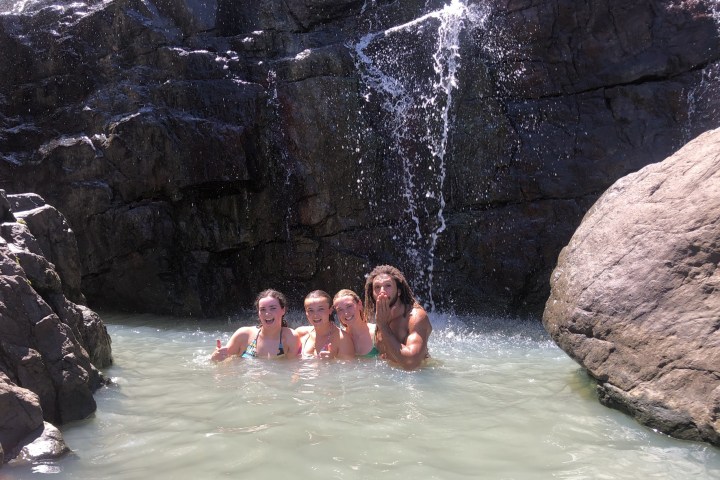 a group of people swimming in the water