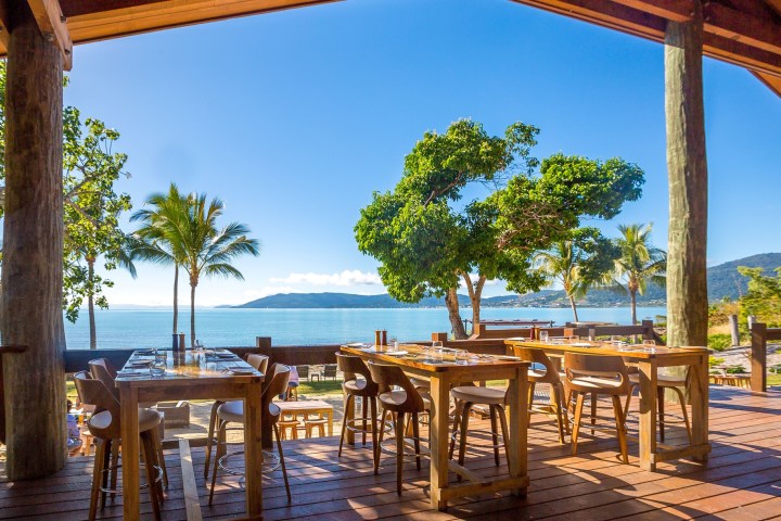 an umbrella sitting on top of a wooden table