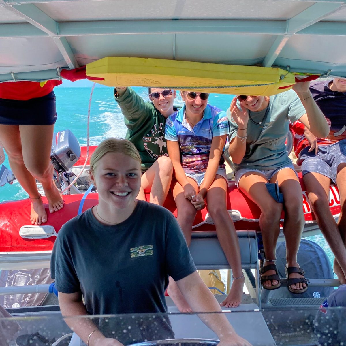 Heuser Paula et al. sitting on a boat